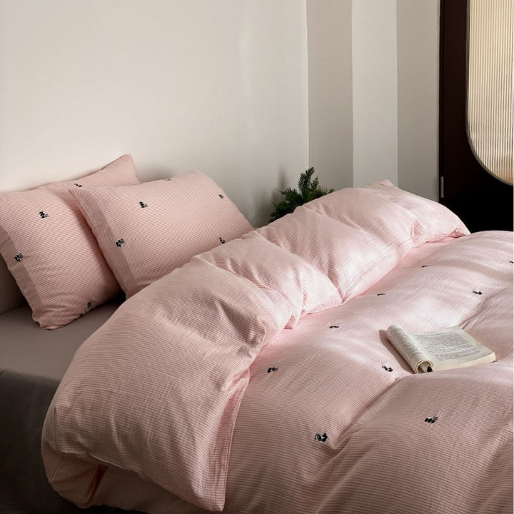 Cotton duvet cover set with fine pinstripes and subtle embroidery applications