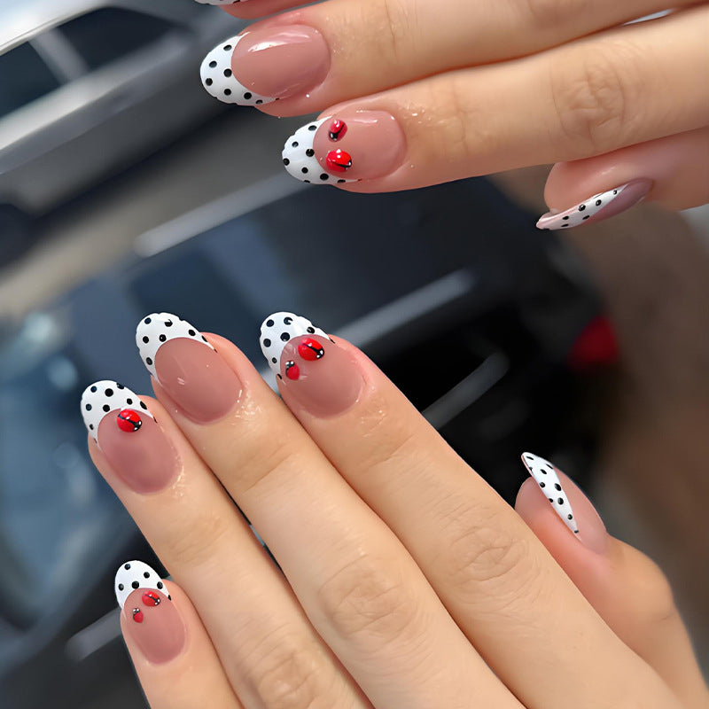 Artificial nail set with playful dots and eye-catching accents Stornfield