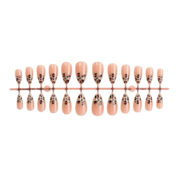 Nail art set with elegant leopard pattern and glitter accents Stornfield