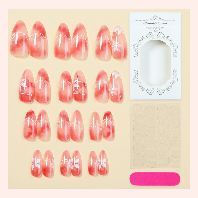 Acrylic nail set with elegant ombre design and floral accent Stornfield
