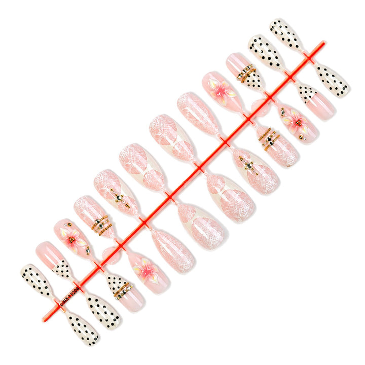 Artificial nail set with floral and glittering accents Stornfield