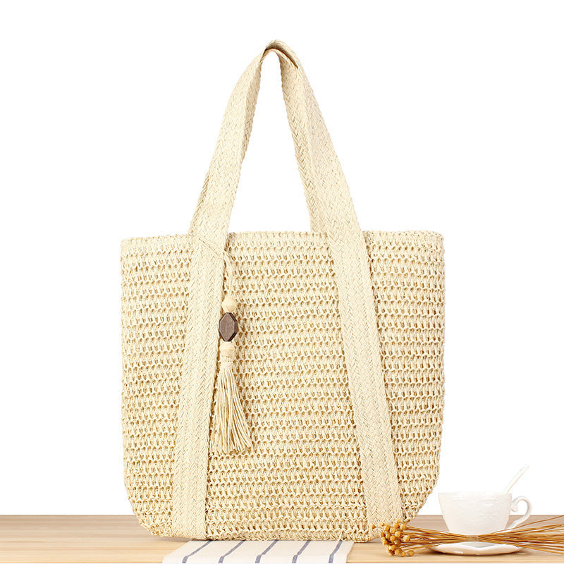 Eco-friendly straw tote bag with elegant tassel detail Stornfield