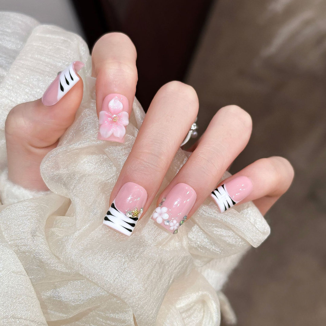 Artistic Press-On Nail Enhancements with Pattern and Gem Accents