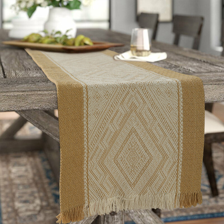 Woven table runner with geometric ethnic ornament and fringes Stornfield
