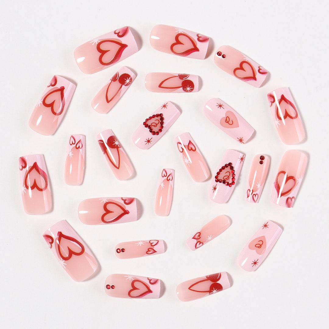 Artificial nail set with romantic heart designs and sparkling rhinestone decorations Stornfield