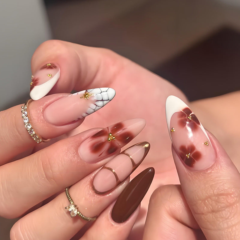 Artificial nail set with elegant floral and glamorous design elements Stornfield