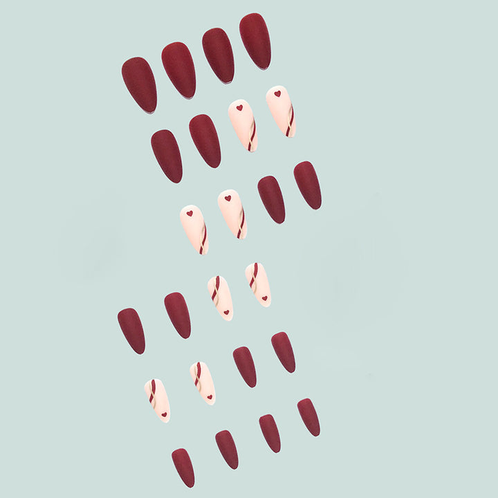 Artful and elegant artificial nails with heart decorations Stornfield
