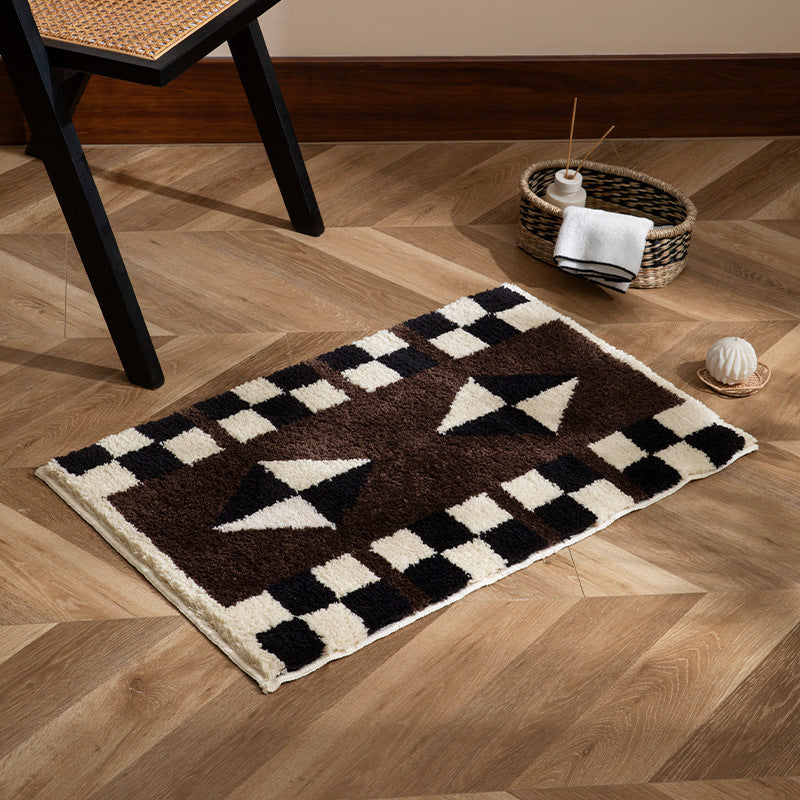 Tufted, soft bath mat with geometric ethnic pattern and non-slip underside Stornfield
