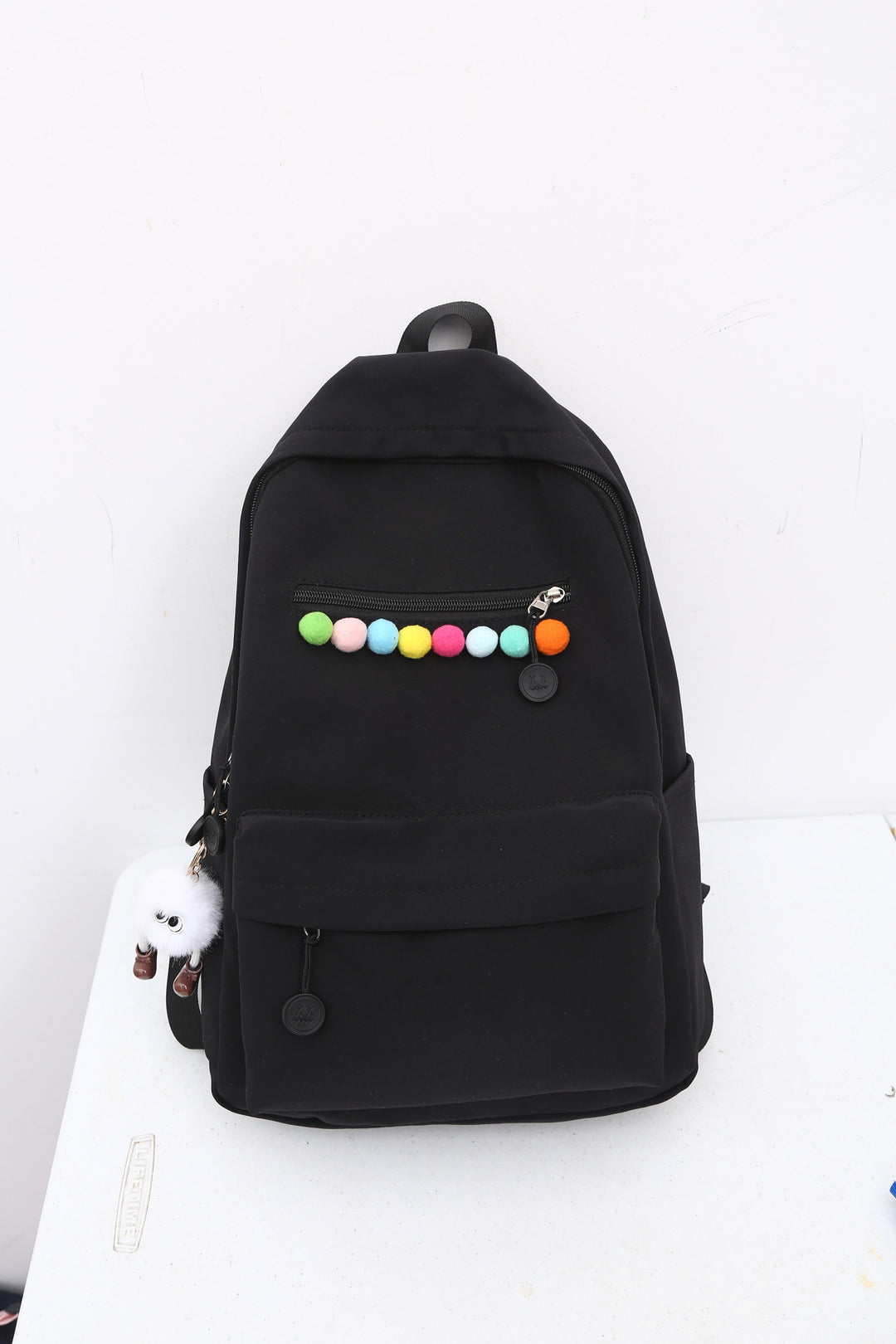Practical backpack with colorful applications Stornfield