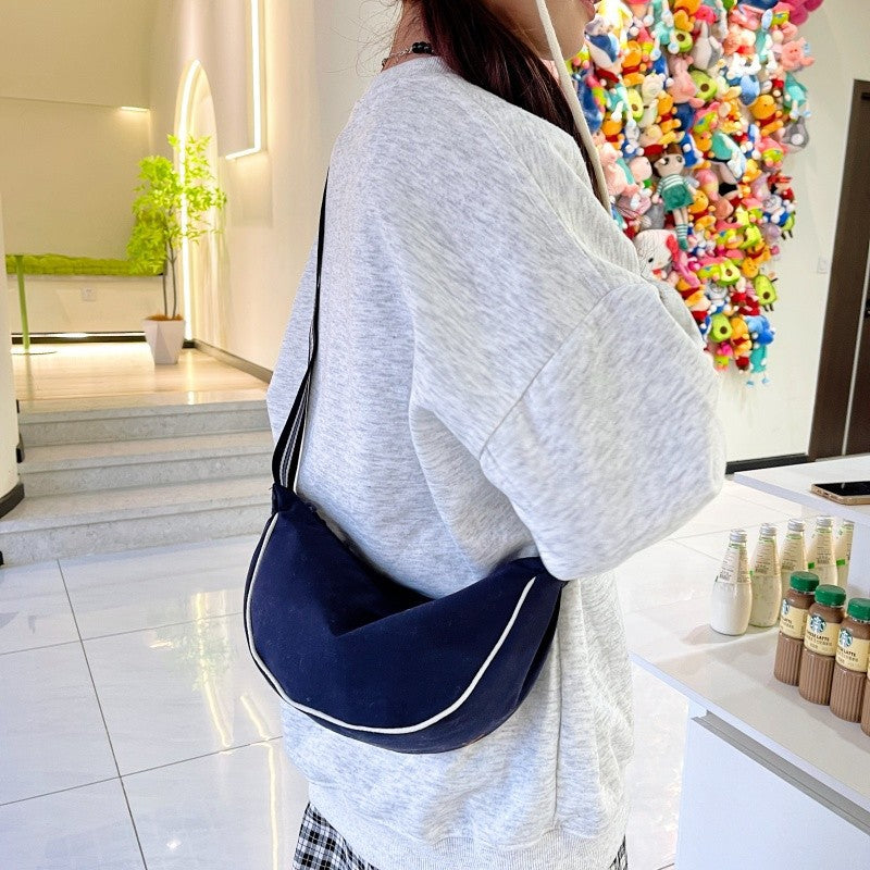 Fashionable shoulder bag with unique cut and adjustable strap Stornfield