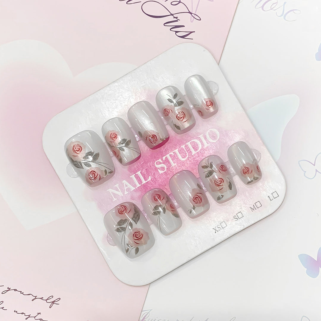 Artful nail extensions with rose designs Stornfield