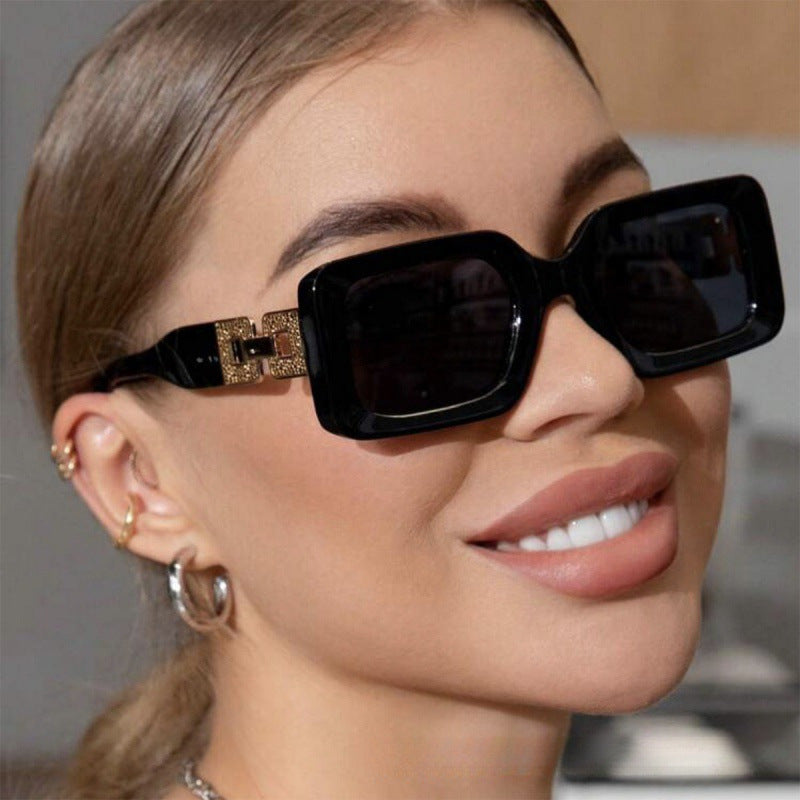 Women’s fashionable sunglasses in elegant square design with luxurious golden accents Stornfield