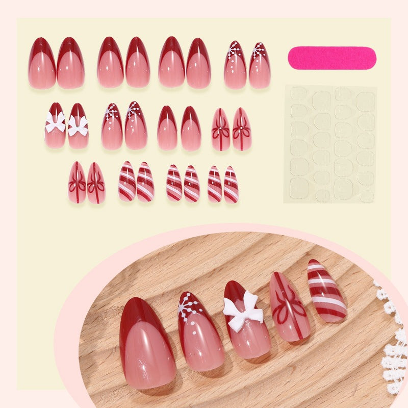 Art nail set with festive design, charming decorations, and glitter accents Stornfield