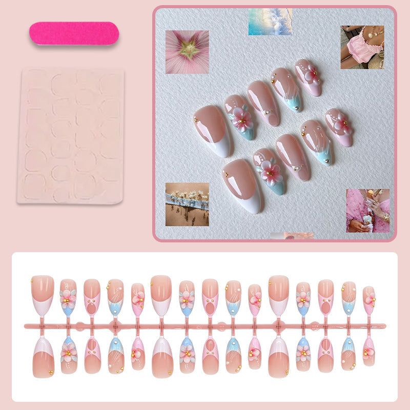 Artificial nail set with romantic floral motifs and elegant accents Stornfield