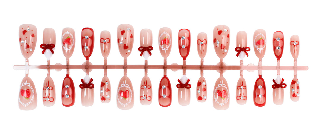 Artificial nail set with cute heart and bow designs Stornfield