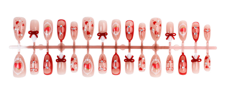 Artificial nail set with cute heart and bow designs Stornfield