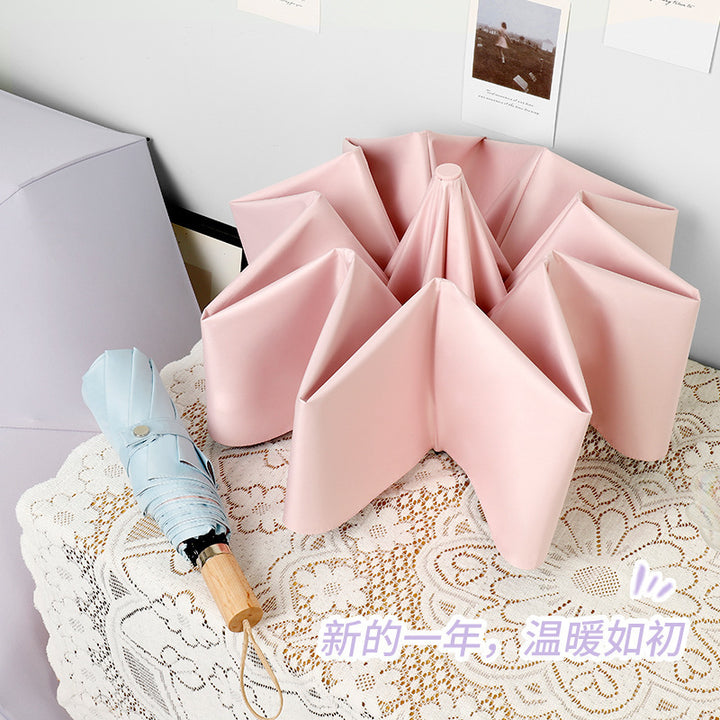 Ladies elegant folding umbrella in portrait format with stylish wooden handle Stornfield