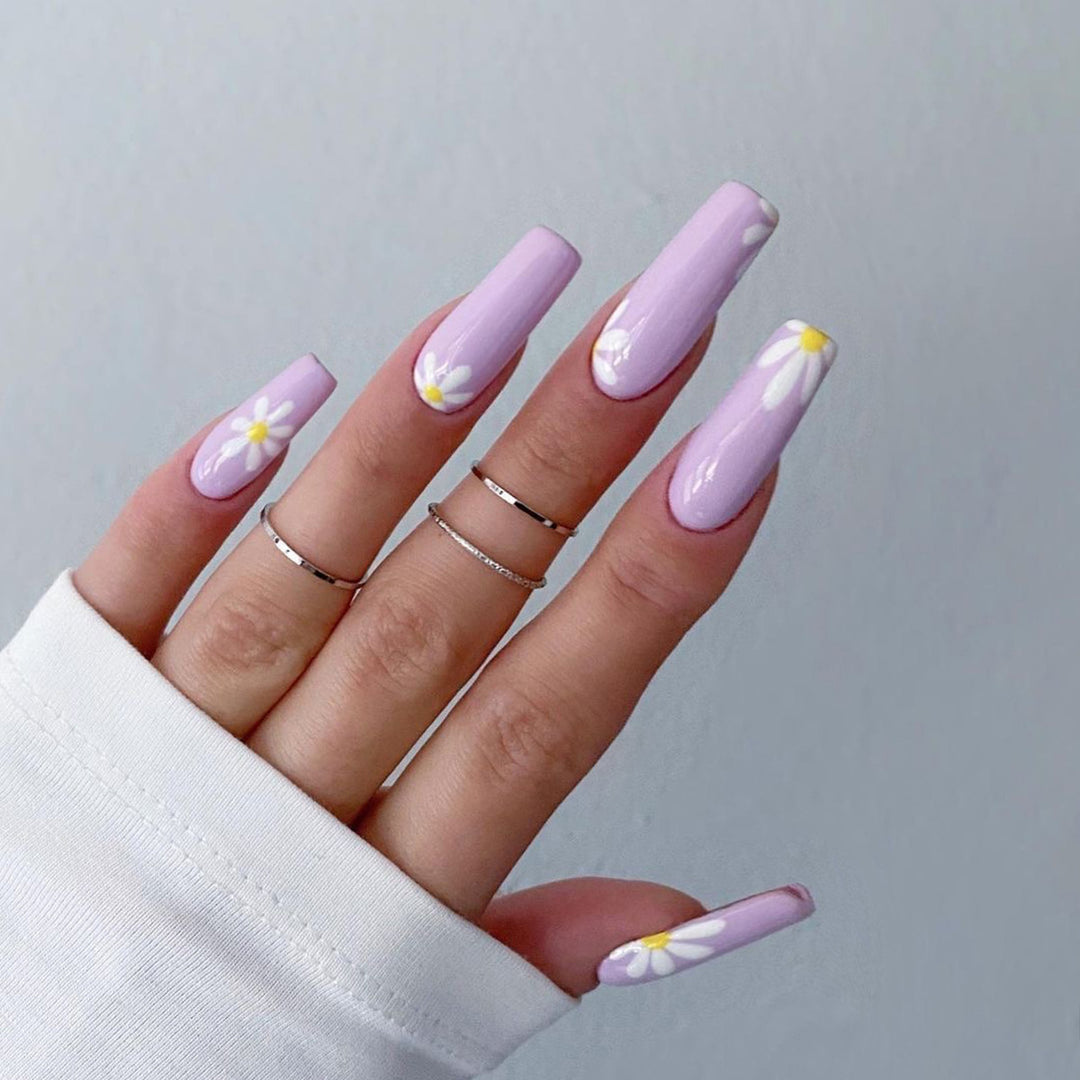 Artistic acrylic nails with flower decoration Stornfield