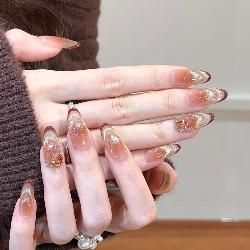 Glamorous art nails with glitter and stone accents Stornfield