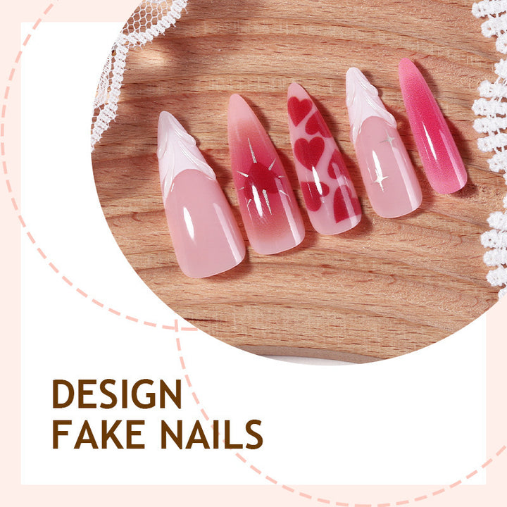 Artificial nail set with luxurious ombre design and creative heart motifs Stornfield