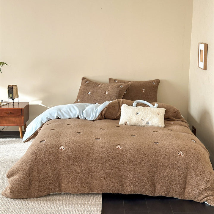Sherpa bed blanket and reversible bed cover with embroidered flower appliqués