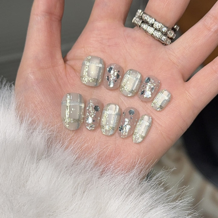 Glamorous artificial nail tips with metallic detail Stornfield