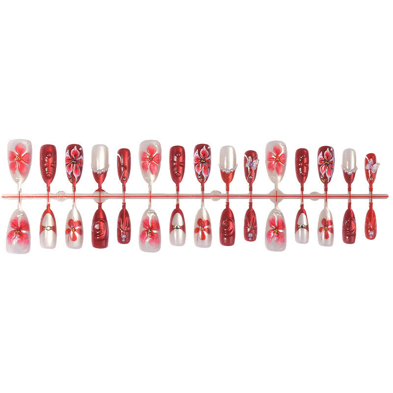 Artificial nail set with floral designs and glamorous accents Stornfield