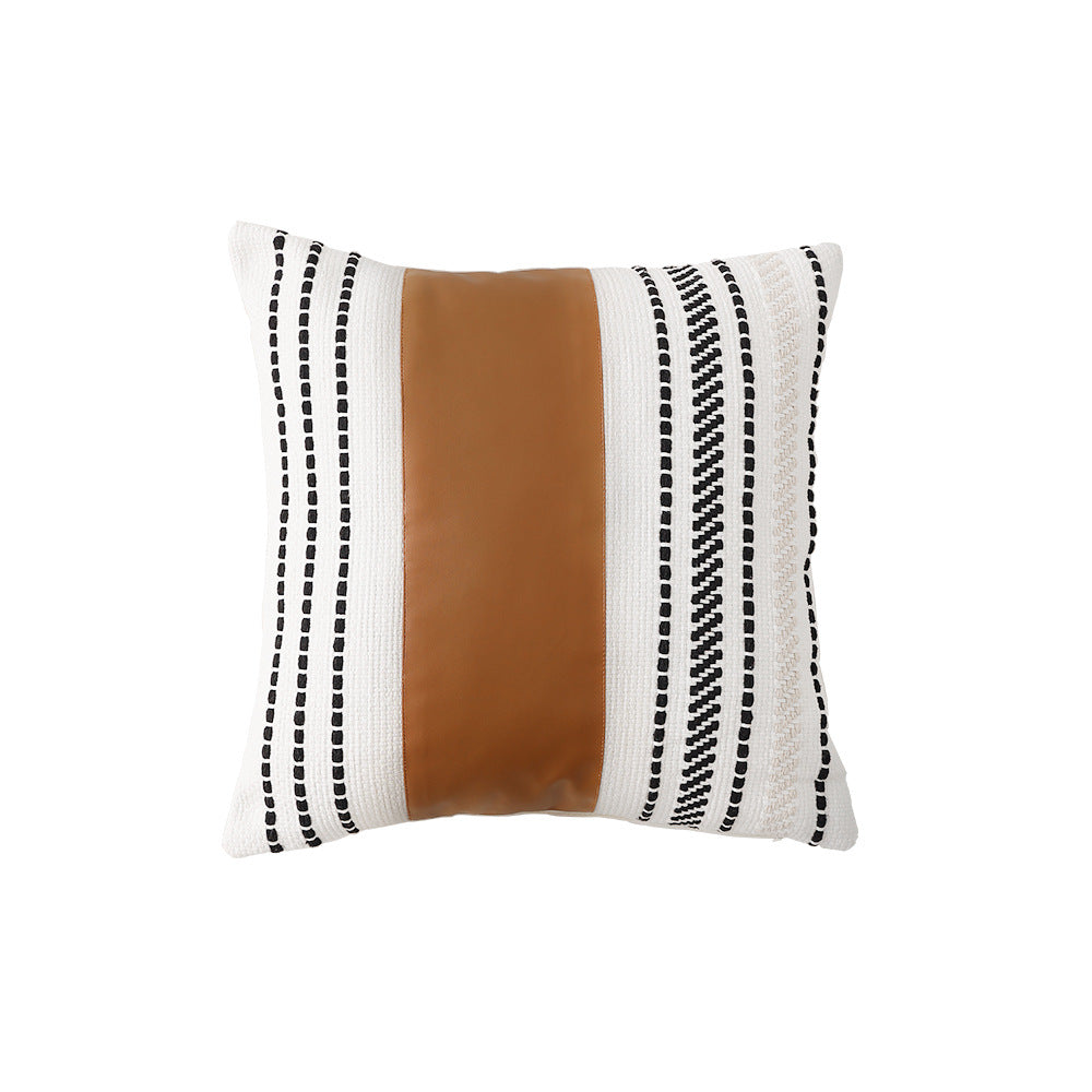 Square faux leather decorative cushion with woven central stripe and fringes