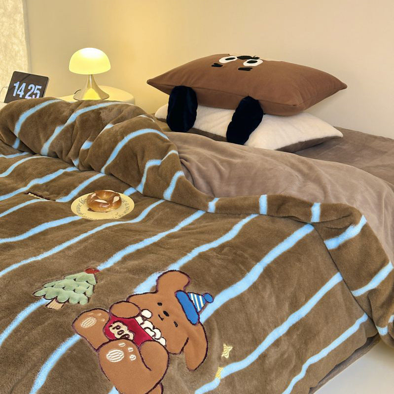 Cozy bedding and cuddly blanket set with embroidered cat appliqués
