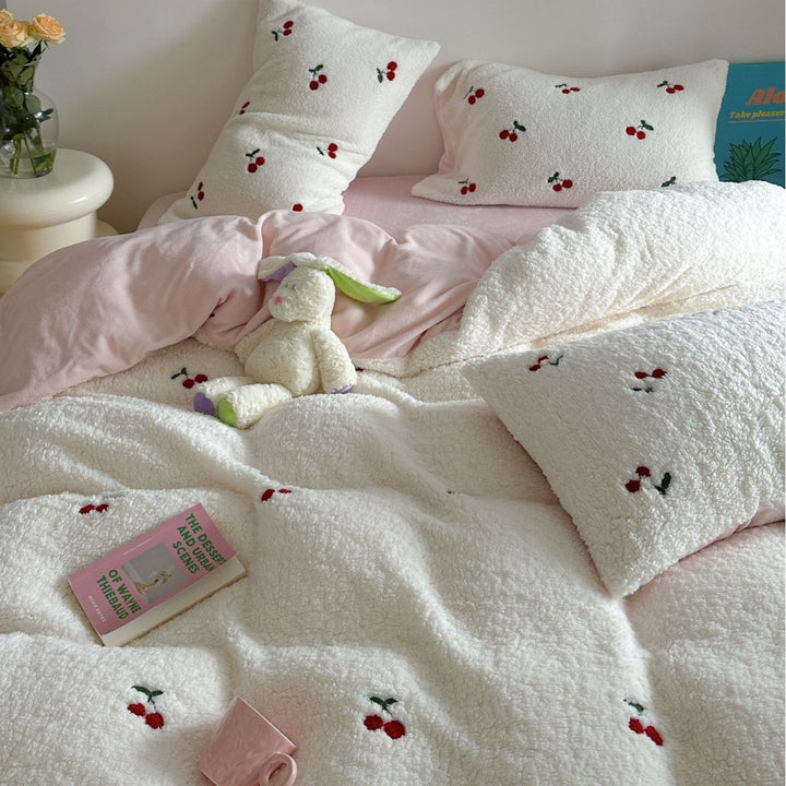 Cozy Sherpa blanket with embroidered teddy and cake motifs