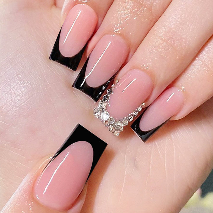Artificial nail set with luxurious French design and sparkling rhinestone decorations Stornfield