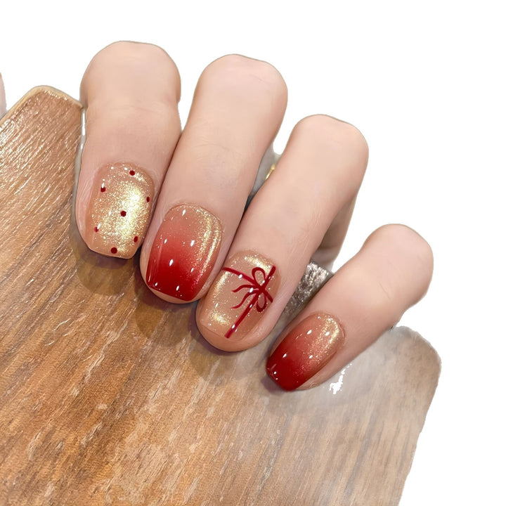 Artificial nails with festive gradient color and elegant decorations Stornfield