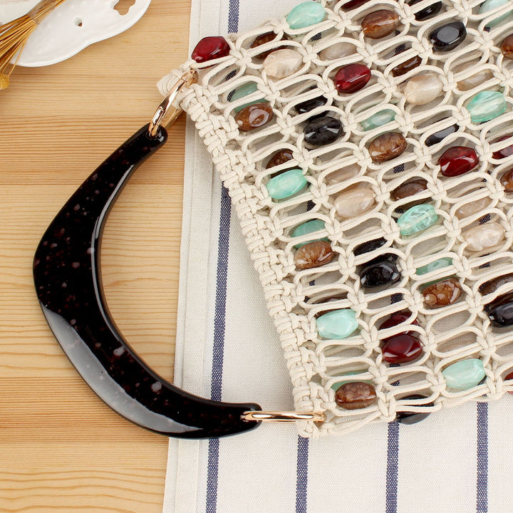 Fashionable handbag in creative net design with colorful accents Stornfield