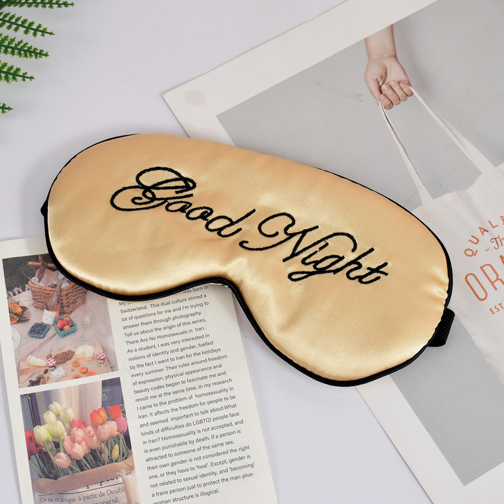 Unisex embroidered contoured sleep mask with decorative text embroidery and adjustable elastic band Stornfield