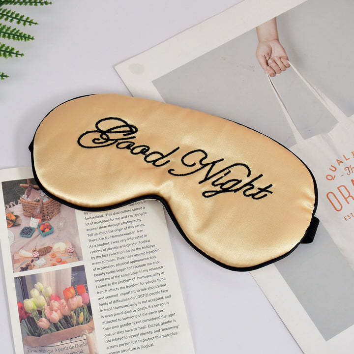Unisex embroidered contoured sleep mask with decorative text embroidery and adjustable elastic band Stornfield