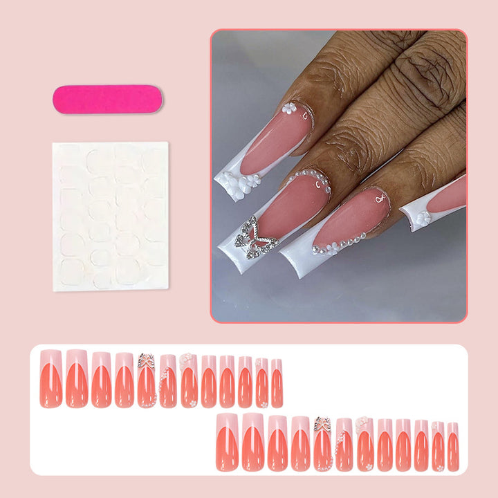 Artificial nail set with elegant floral decorations and glitter accents Stornfield