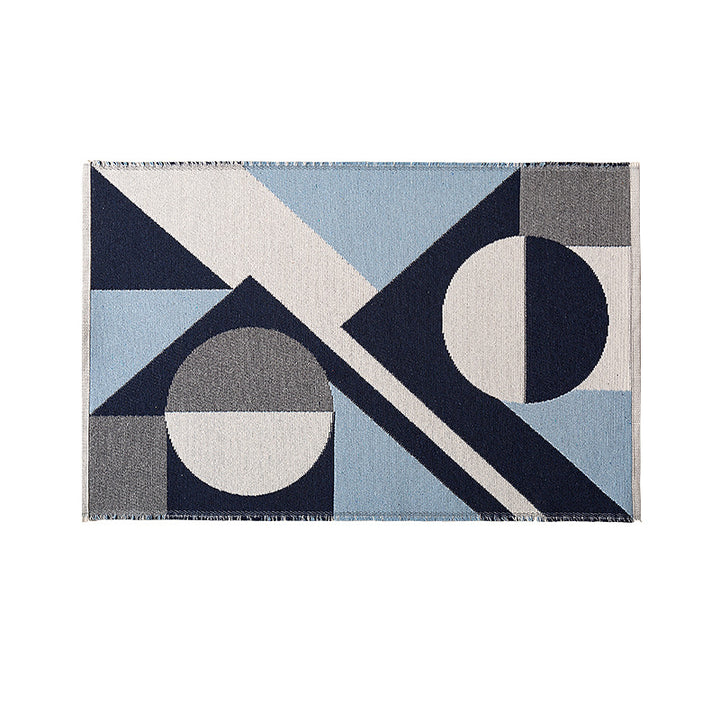 Flat-woven living room rug in a graphic tile pattern