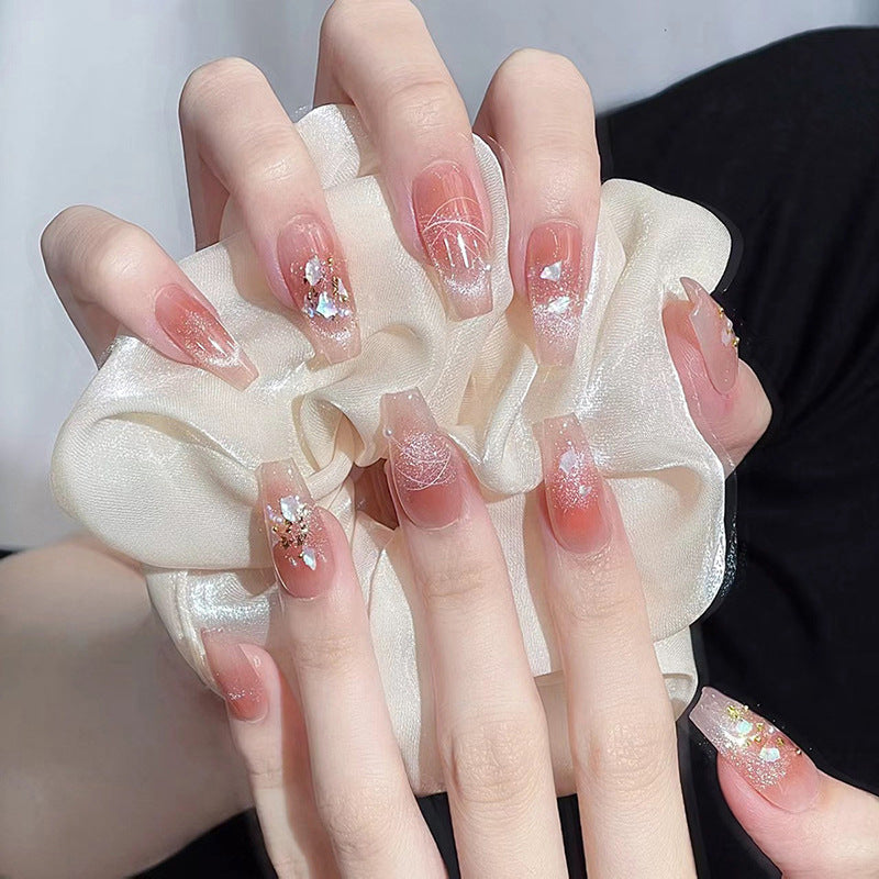 Artificial nail set with elegant glitter and flower decorations Stornfield