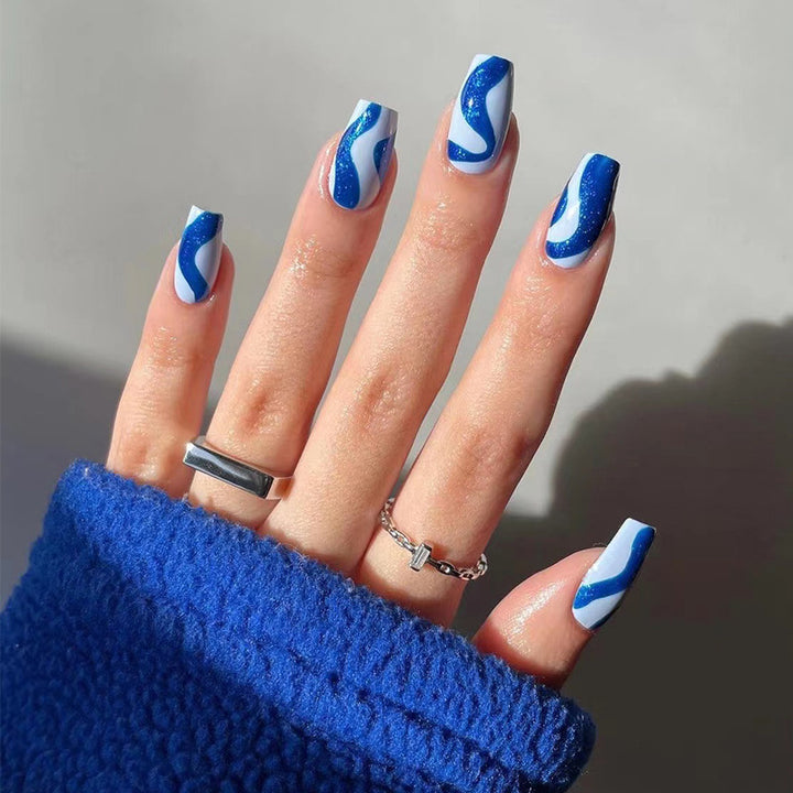 Artful nail extensions with an elegant leaf pattern Stornfield