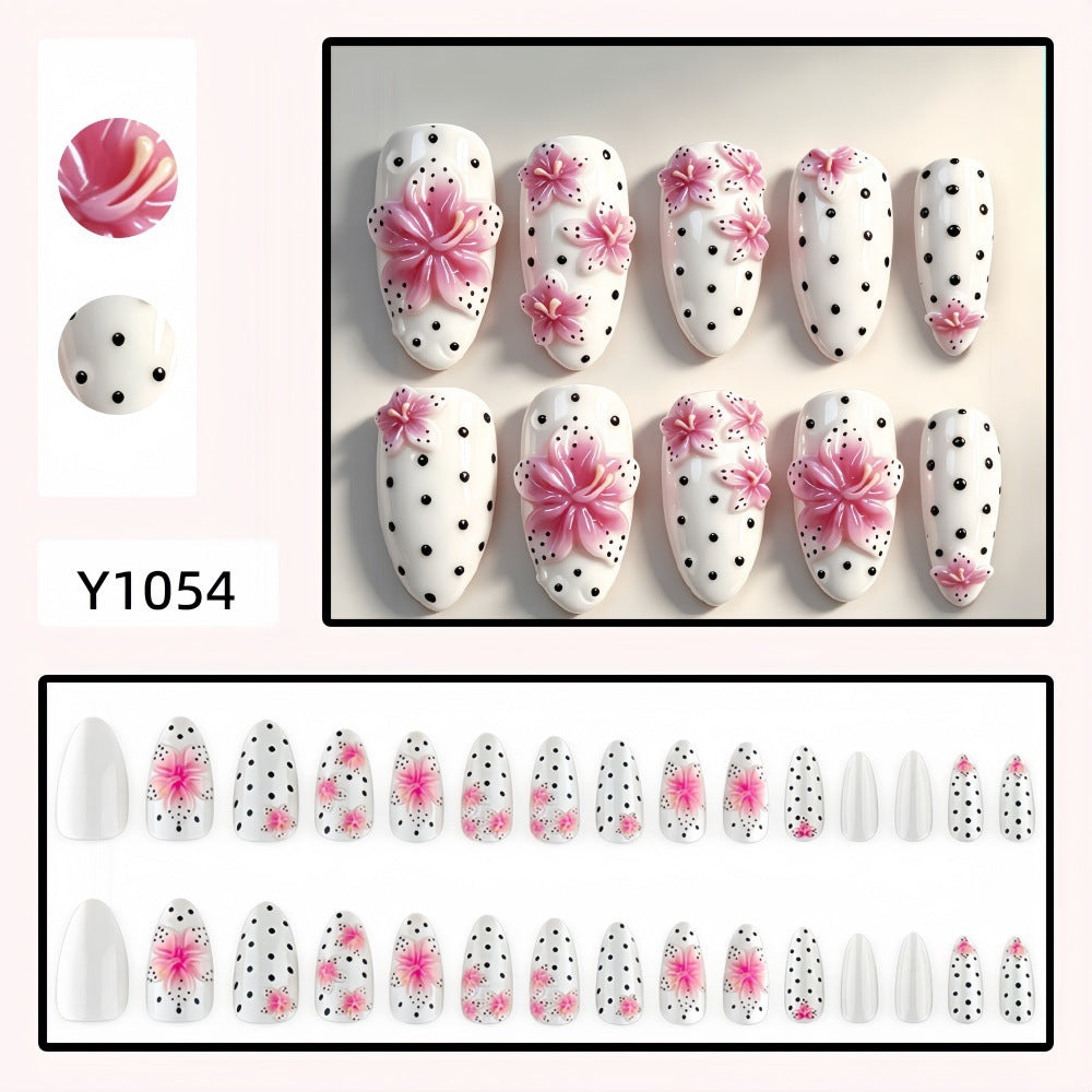 Artificial nail set with floral accents and polka dots Stornfield