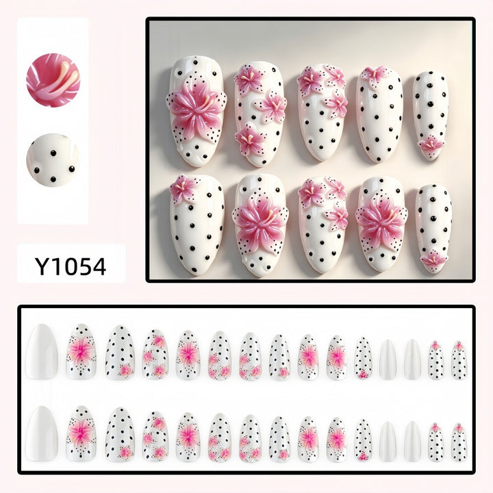 Artificial nail set with floral accents and polka dots Stornfield