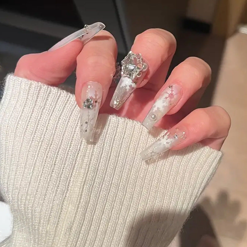 Artificial nail set with frosty snowflake design and sparkling 3D applications Stornfield