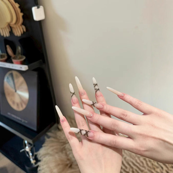 Elegant Stiletto Nail Enhancements with Artistic Accents