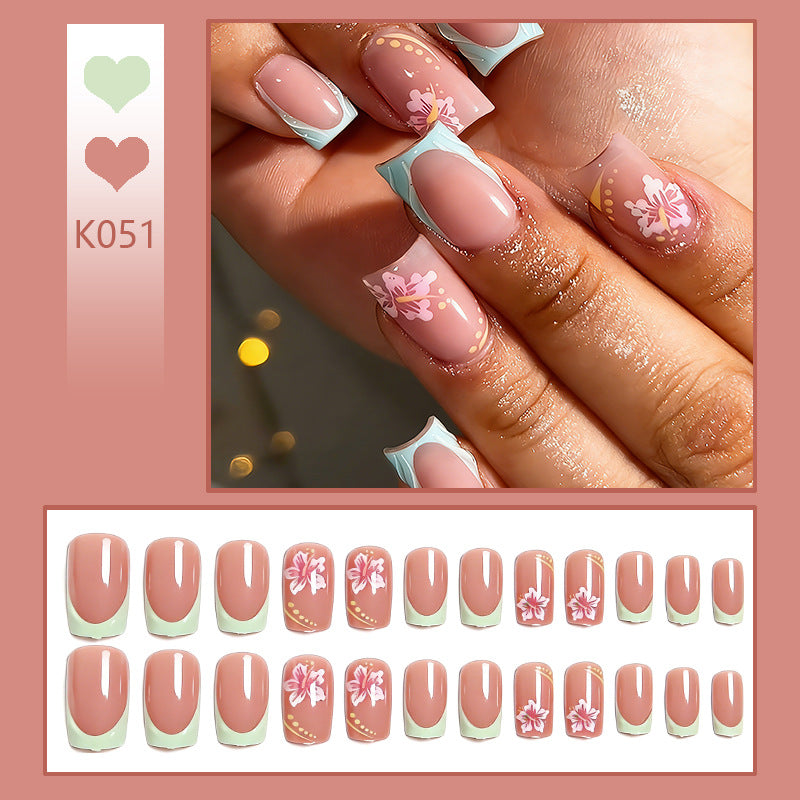Artificial nail set with floral motifs and shiny accents Stornfield