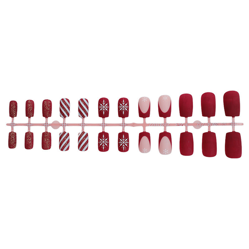 Artificial nail set with festive holiday motifs and sparkling accents Stornfield