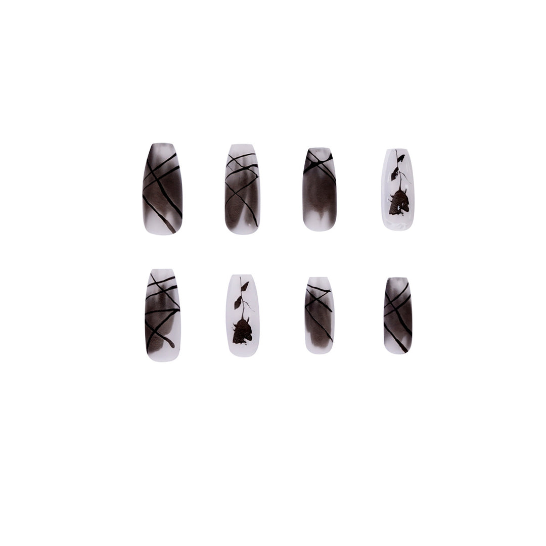 Artful stiletto nails with floral accents Stornfield