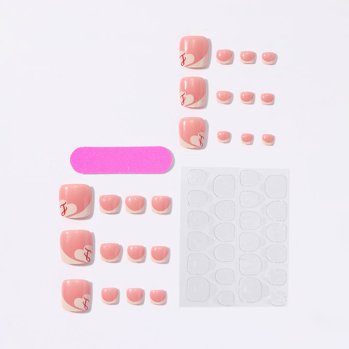 Artificial nail set with elegant French tips and romantic heart designs Stornfield