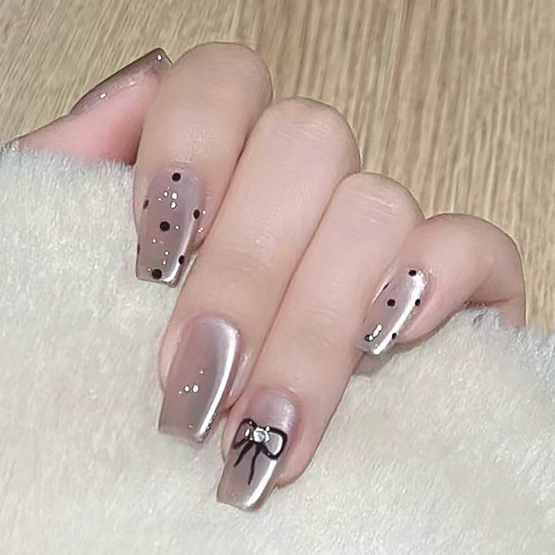 Artful Nail Extensions with Colorful Bow Motifs Stornfield