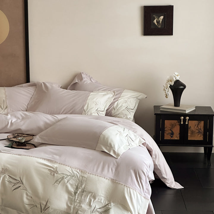 Elegant cotton satin bedding set with embroidered bamboo and butterfly border