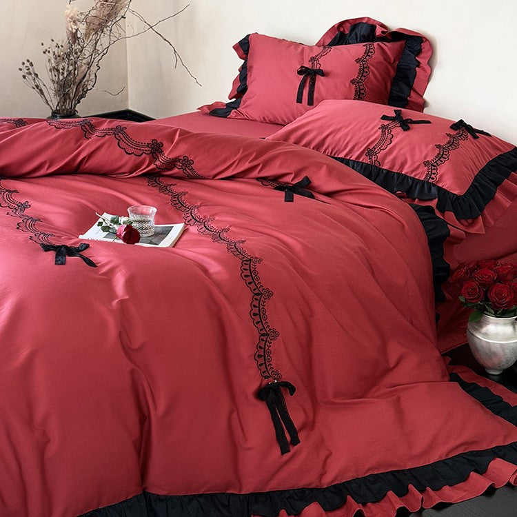 Luxurious satin bedding set with ruffles, lace embroidery and decorative bows